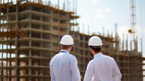 onsite meeting with building in background 
